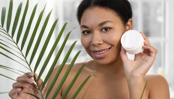 woman-holding-cream-container-front-view