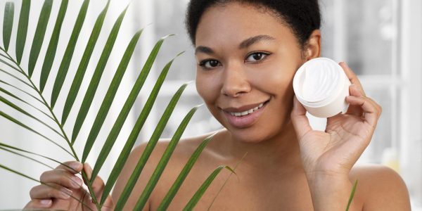 woman-holding-cream-container-front-view